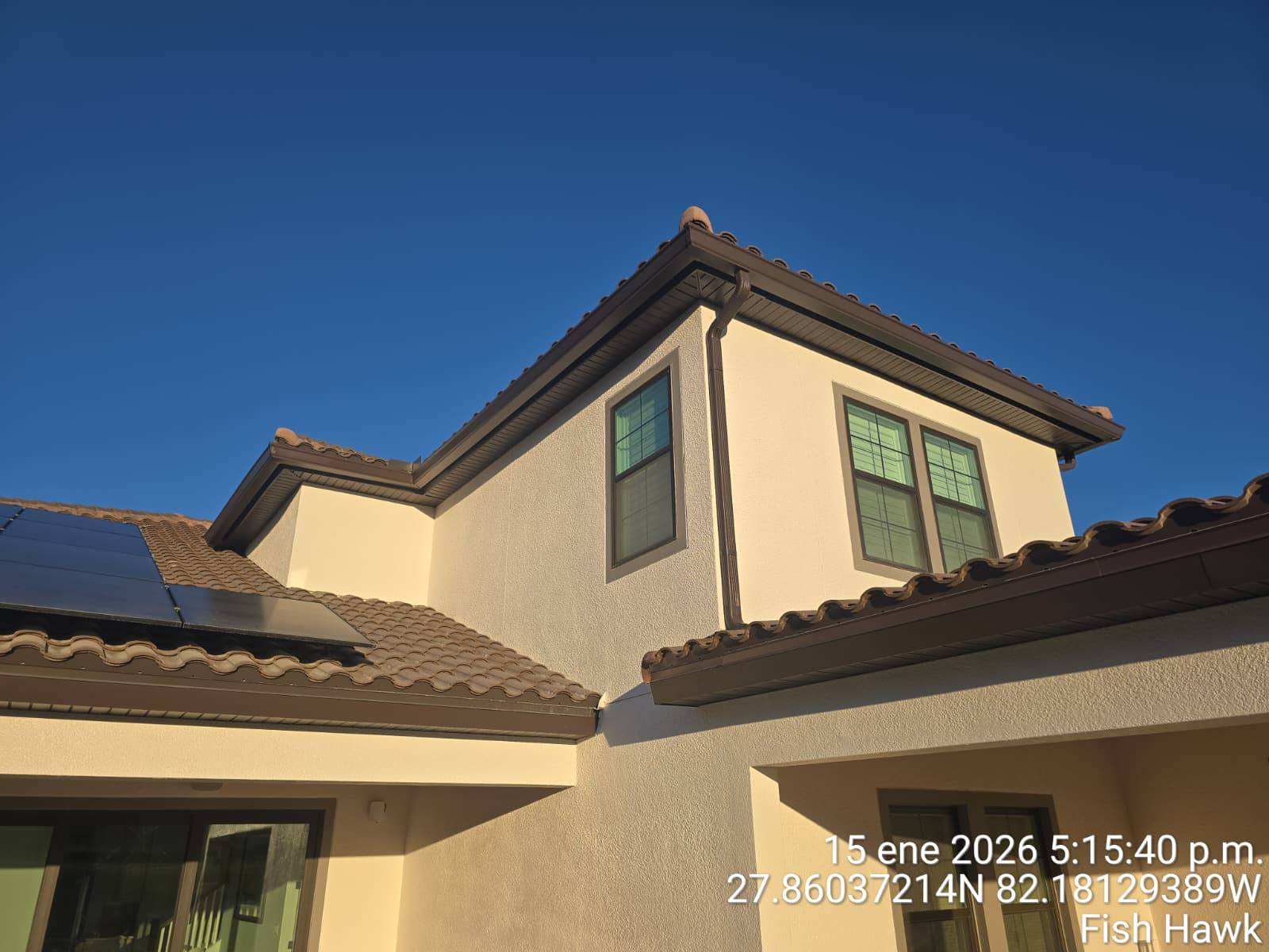 Integrity Pro - Premium Gutters and Exterior Services Seamless gutters and siding installation on residential home in Orlando FL